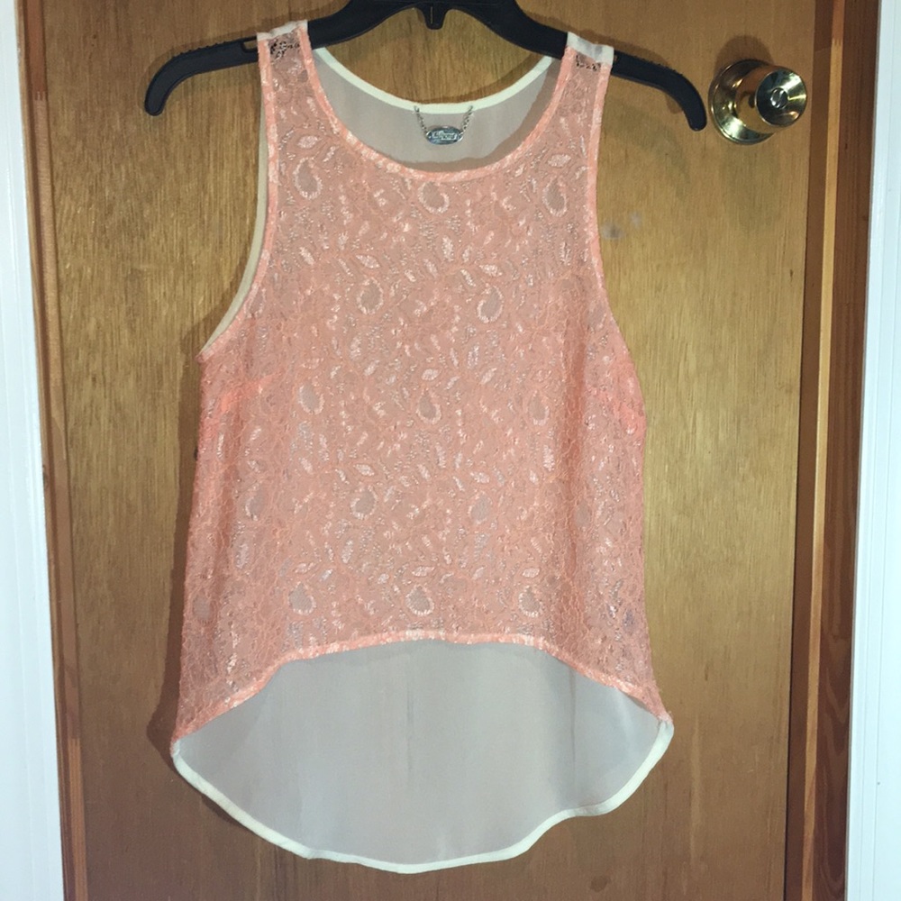 Pink and cream-colored sheer lace top.
